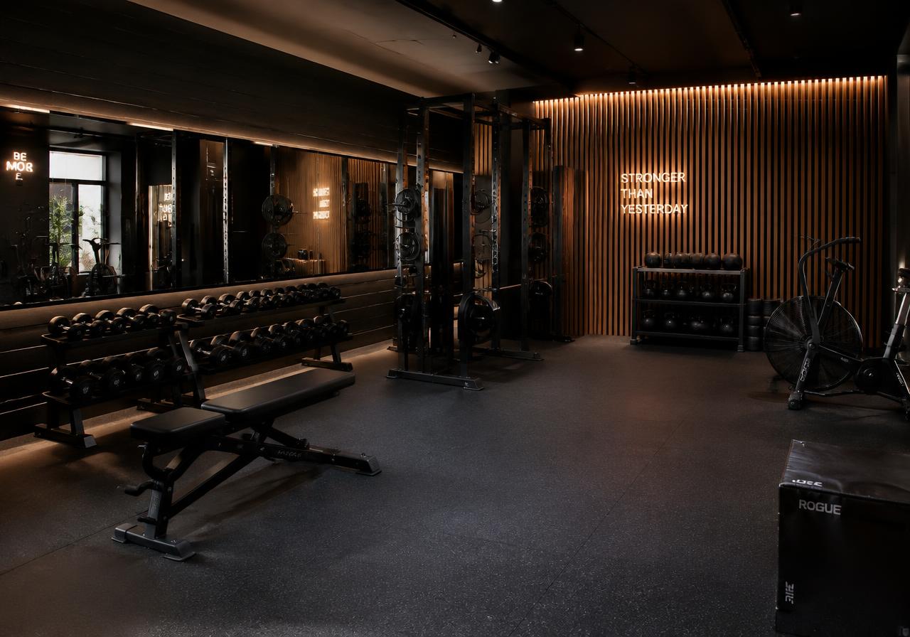 Boutique gym interior with mirror wall and wood slats